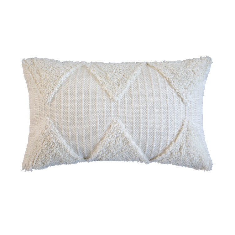 Square decorative pillow with tufted triangle structure and bouclé surface