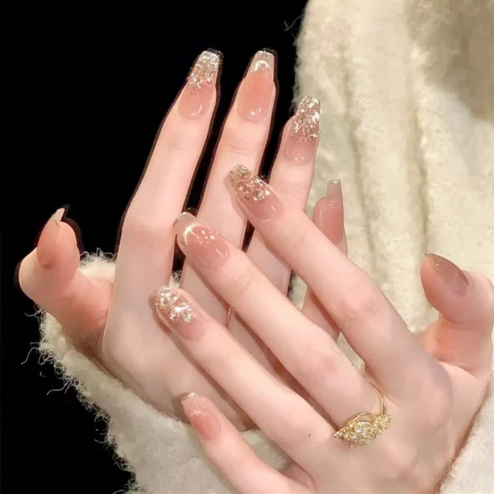 Artificial nail set with sparkling glitter and 3D applications Stornfield