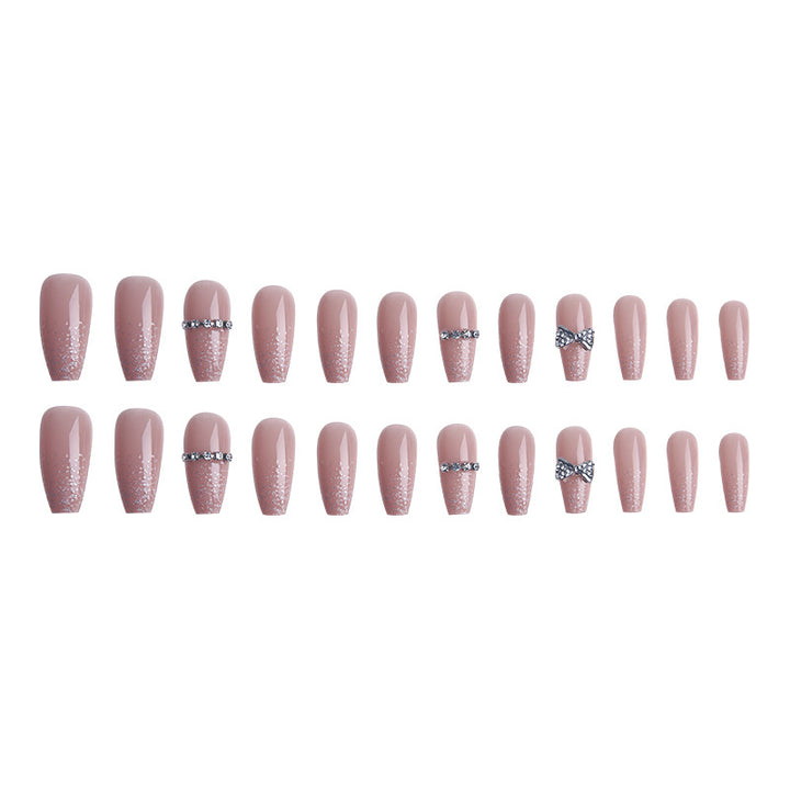 Glamorous artificial nails with sparkling rhinestone and glitter elements Stornfield