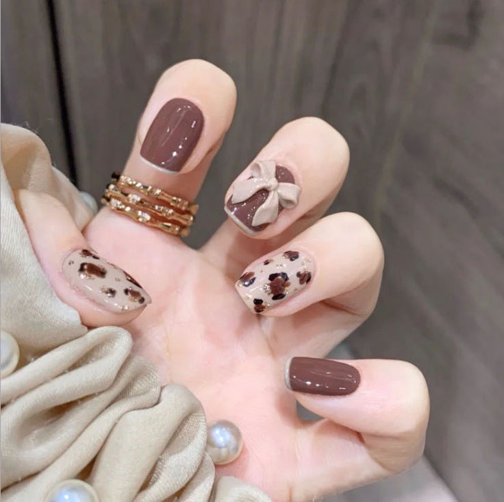 Artful nail tips with elegant foil decorations Stornfield
