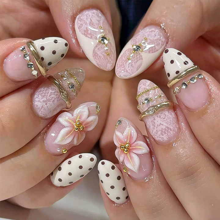 Artful Nail Extensions with Elegant Floral and Glitter Accents Stornfield