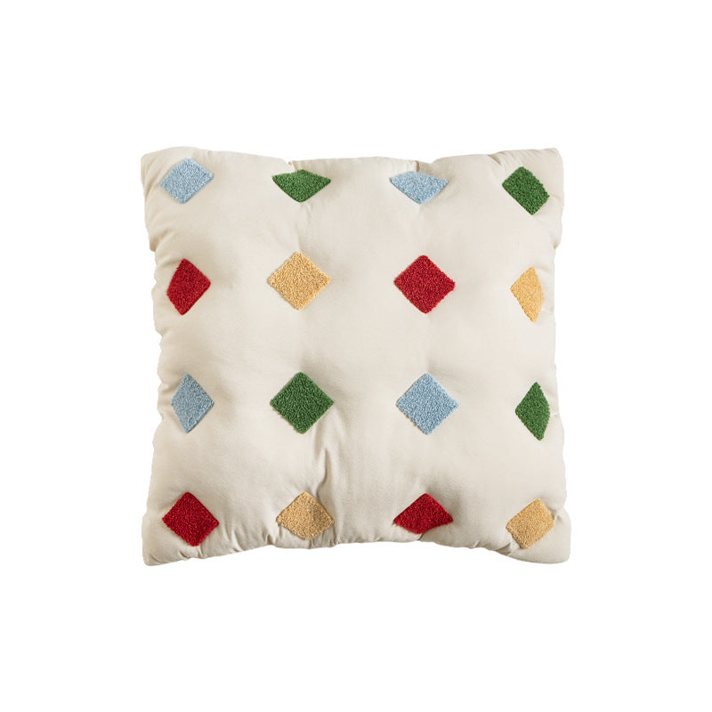 Filled decorative cushion with colorful tuft diamonds and padded structure