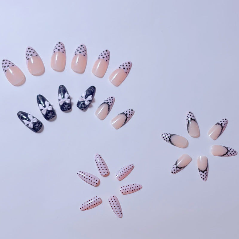 Elegant artificial nails with lace design and bow accents Stornfield
