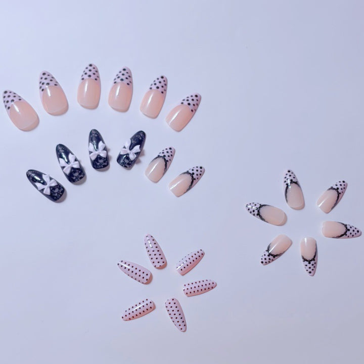 Elegant artificial nails with lace design and bow accents Stornfield