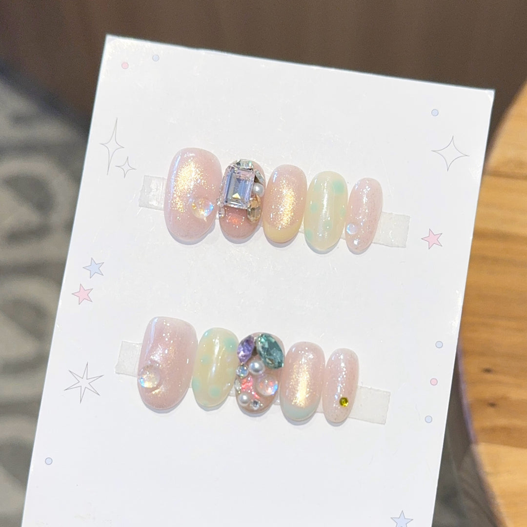Artificial nails with shimmering effects and crystal accents Stornfield