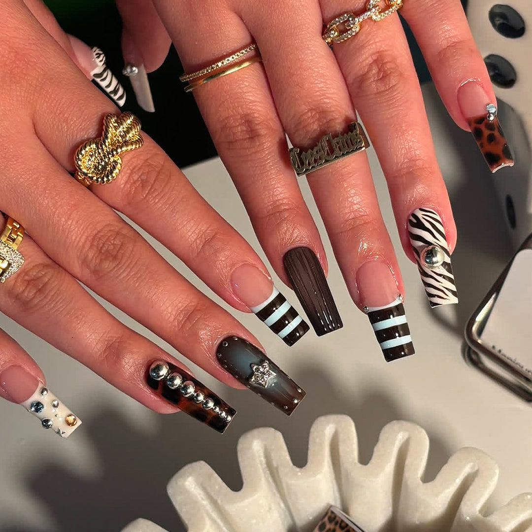 Artificial nails in modern striped design with 3D decoration Stornfield
