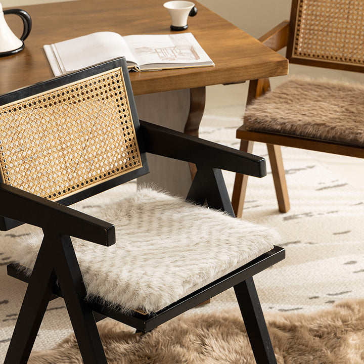 Square chair cushion made of cozy artificial fur with non-slip base and strap attachment Stornfield