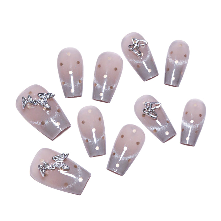 Artificial nail art with glitter details and bow accents Stornfield
