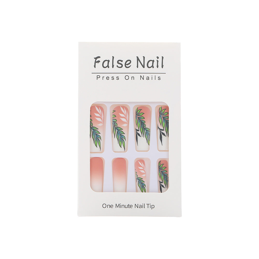 Artificial nails with elegant ombre design and floral accents Stornfield