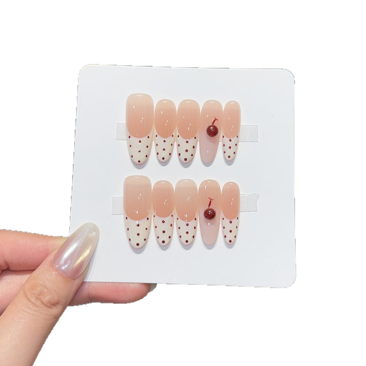 Artificial nails with playful design and cherry accents Stornfield