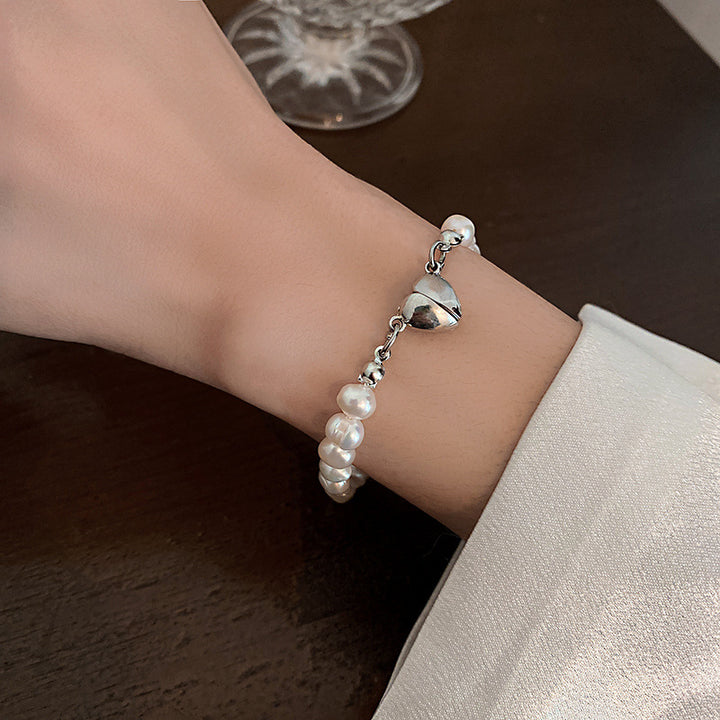 Elegant silver pearl bracelet with heart details Stornfield