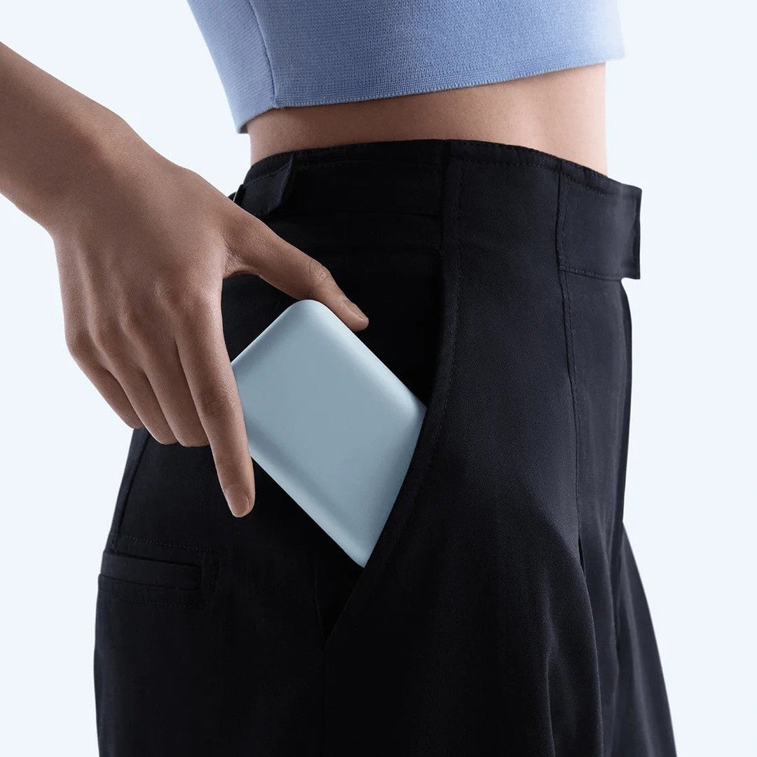 Compact High-capacity portable power bank with integrated USB-C cable and silicone carry loop Stornfield