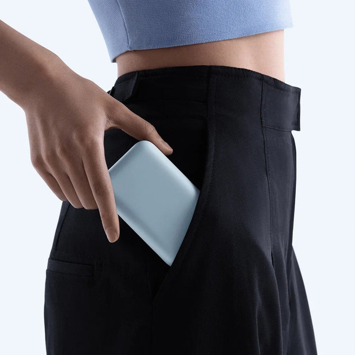 Compact High-capacity portable power bank with integrated USB-C cable and silicone carry loop Stornfield