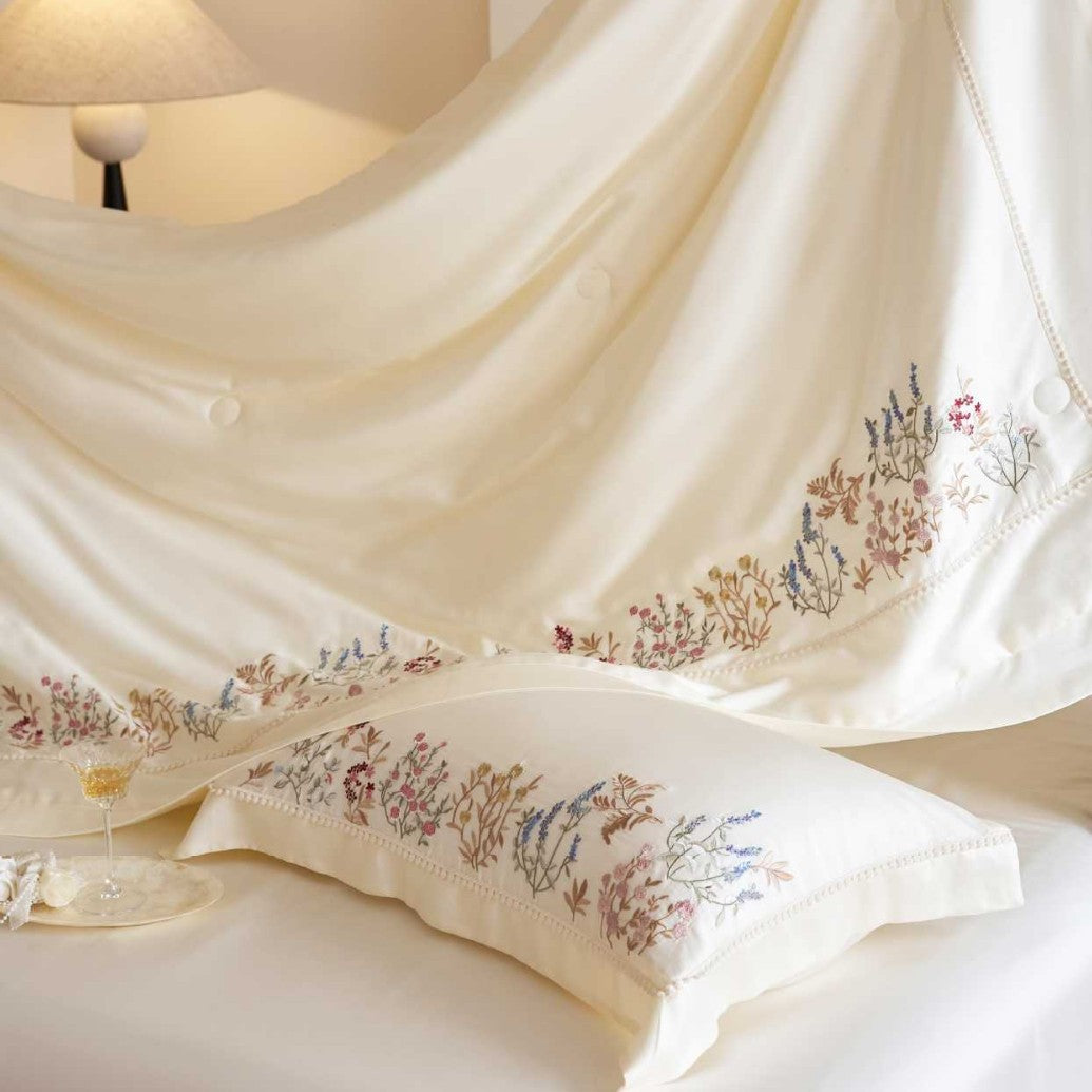 Exclusive satin bed linen set with fine floral embroidery and silky finish