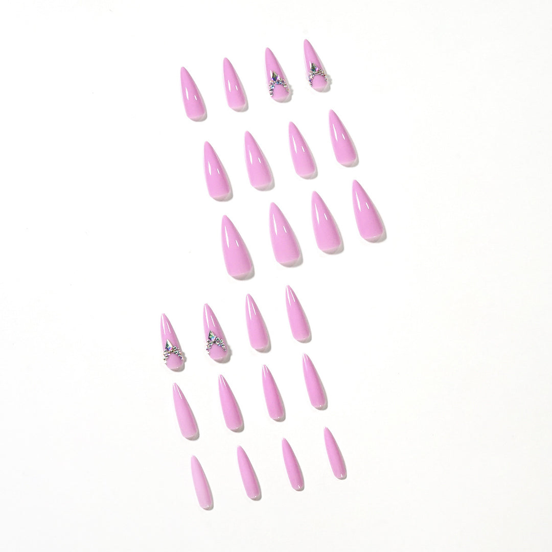 Glamorous stiletto nails with rhinestone decoration Stornfield