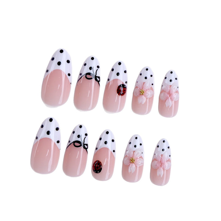 Artificial nail art with floral and playful accents Stornfield