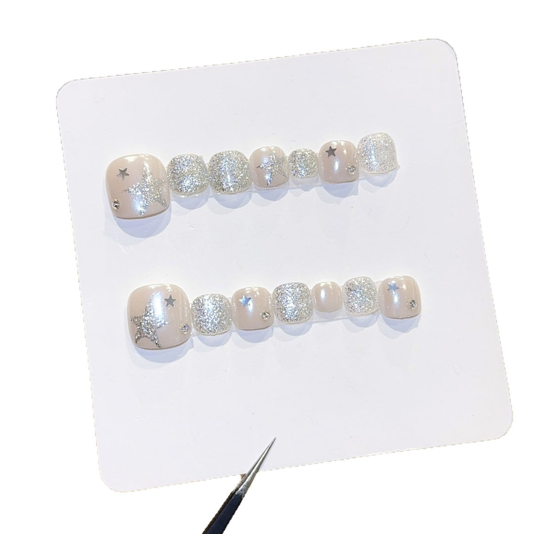 Glamorous artificial nails with sparkling stars and glitter accents Stornfield