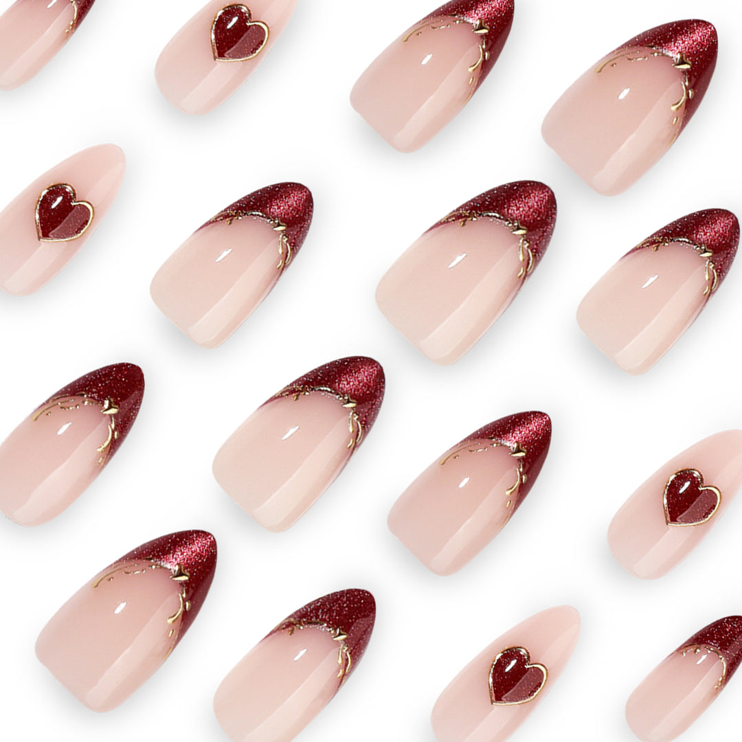 Artful stiletto nails with heart designs and glitter embellishment Stornfield