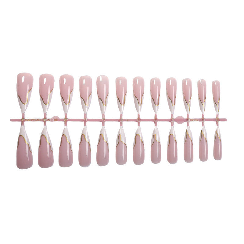 Artifical nail set with elegant gold trim and delicate pink Stornfield