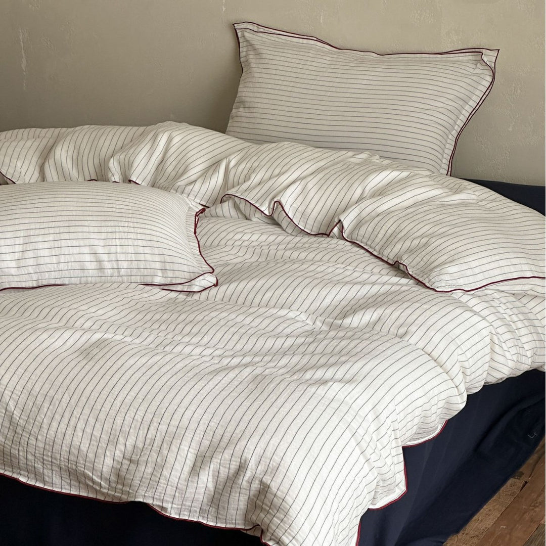 Cotton duvet cover set with fine pinstripes and subtle embroidery applications