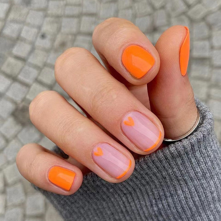 Creative Nail Art with Heart Designs and Neon Accents Stornfield