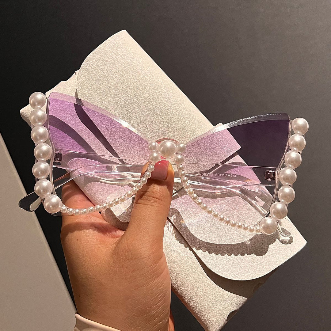 Women striking sunglasses with pearl decoration Stornfield