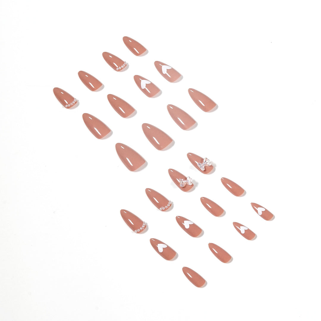 Elegant artificial nails with heart-shaped and glitter accents Stornfield