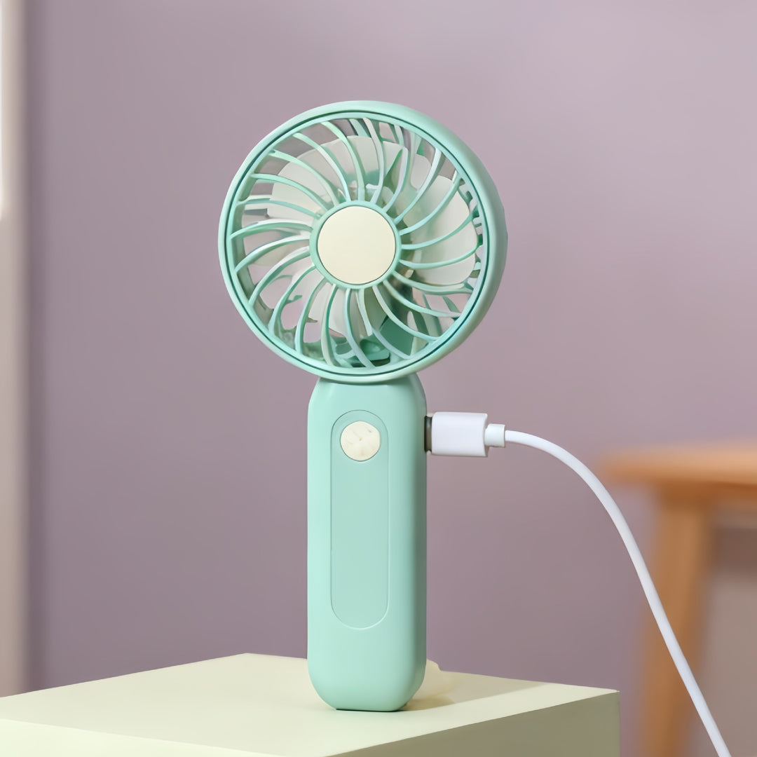 Women's portable battery-operated hand fan with ergonomic design and USB charging Stornfield