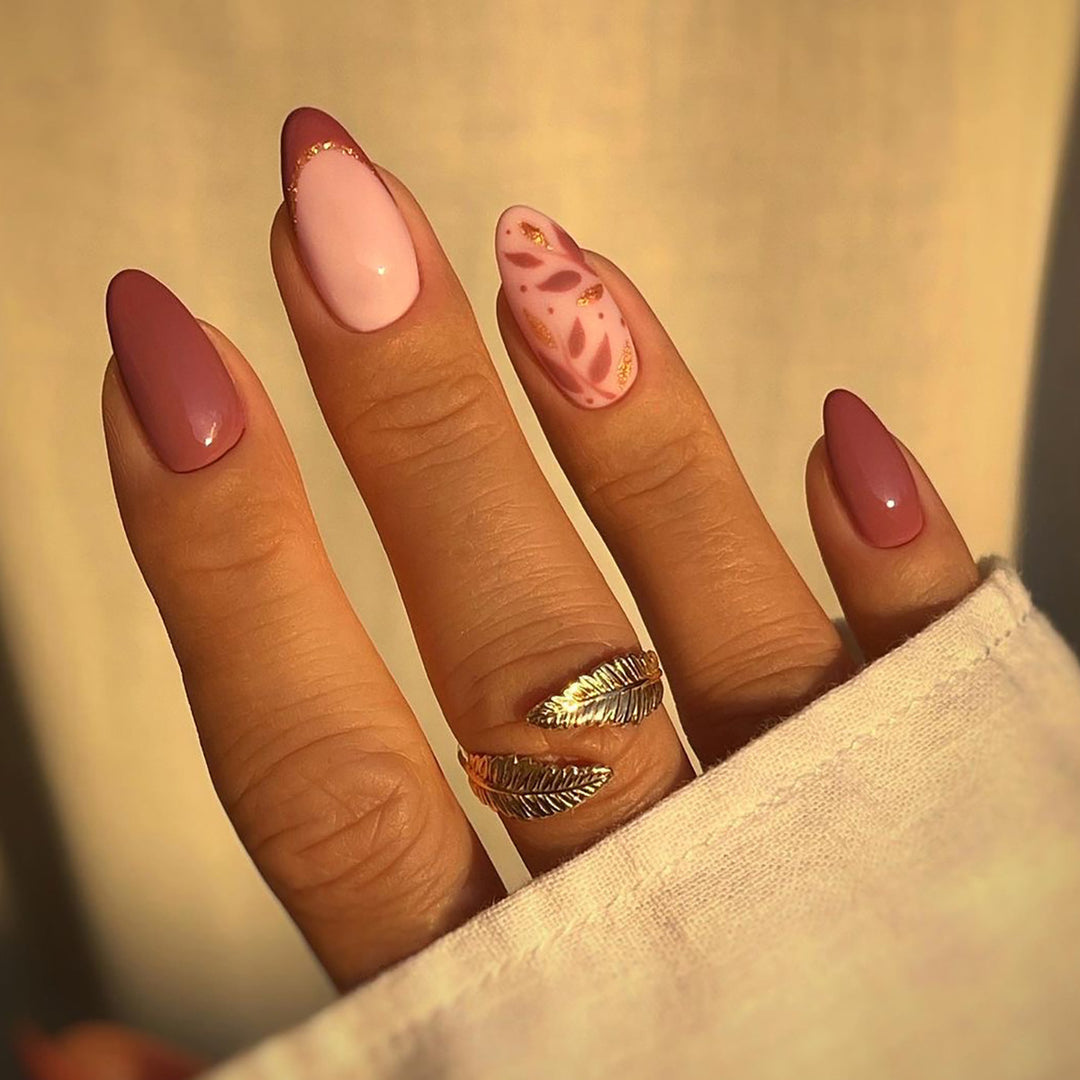 Artful nail extensions with an elegant leaf pattern Stornfield