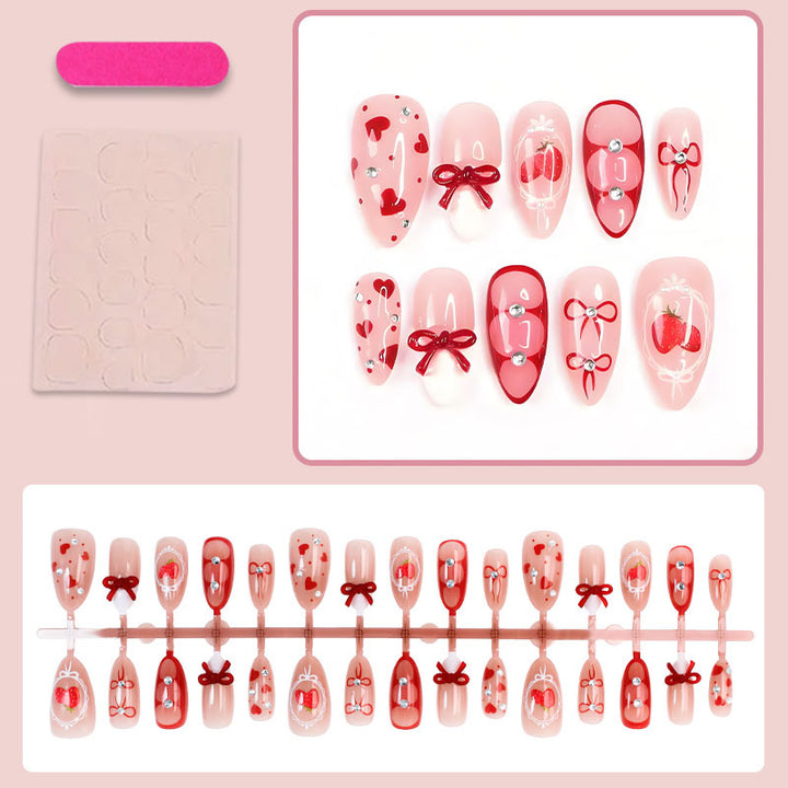Artificial nail set with cute heart and bow designs Stornfield