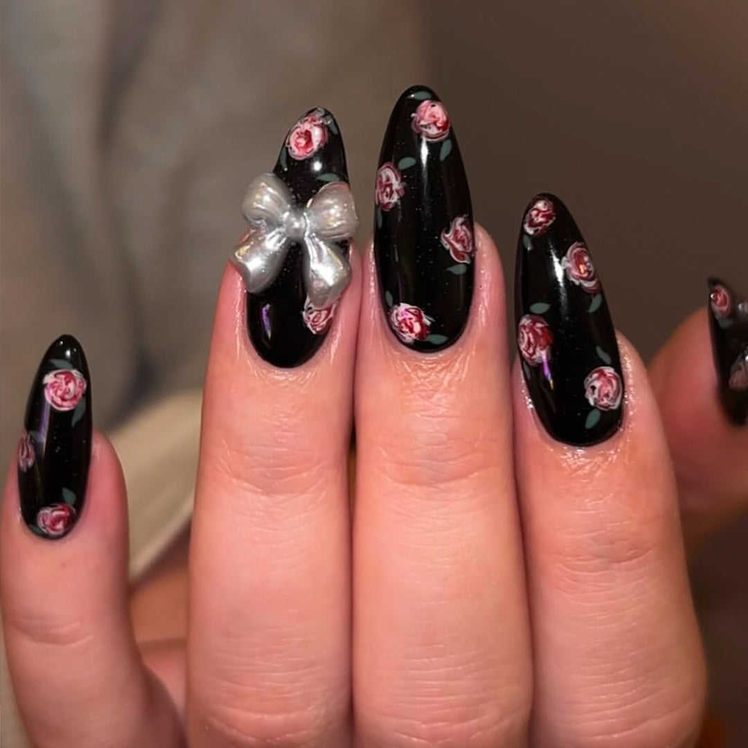 Artificial nails with floral decorations and glamorous bow detail Stornfield