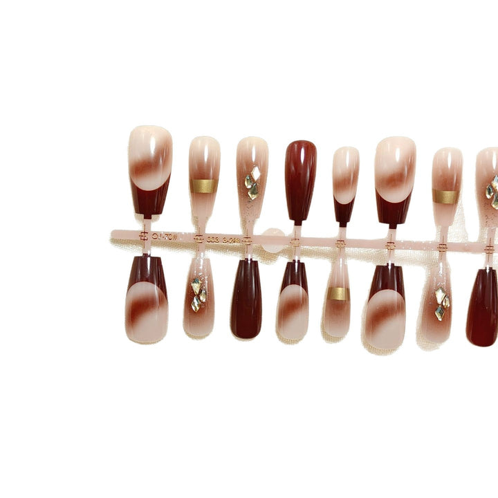 Artificial nails with elegant color gradients and jewelry details Stornfield