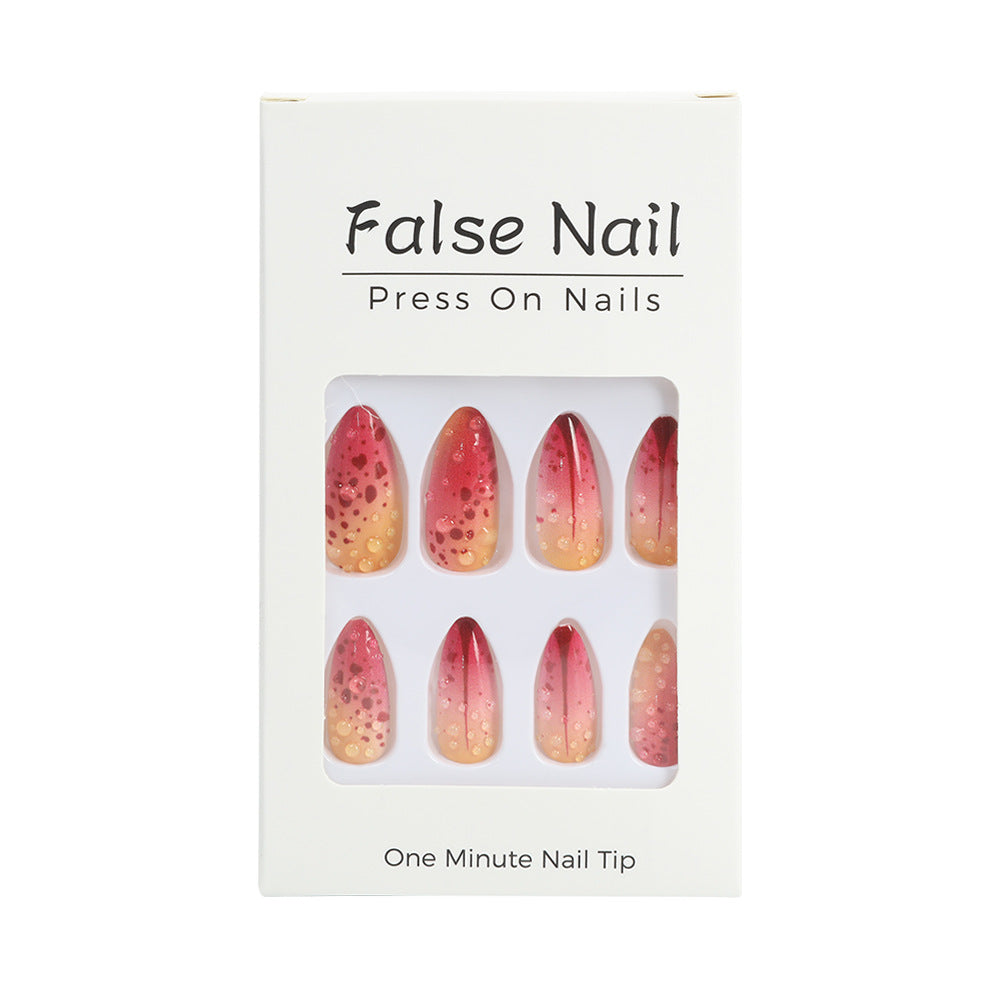 Creative artificial nails with appealing ombre and glitter effects Stornfield
