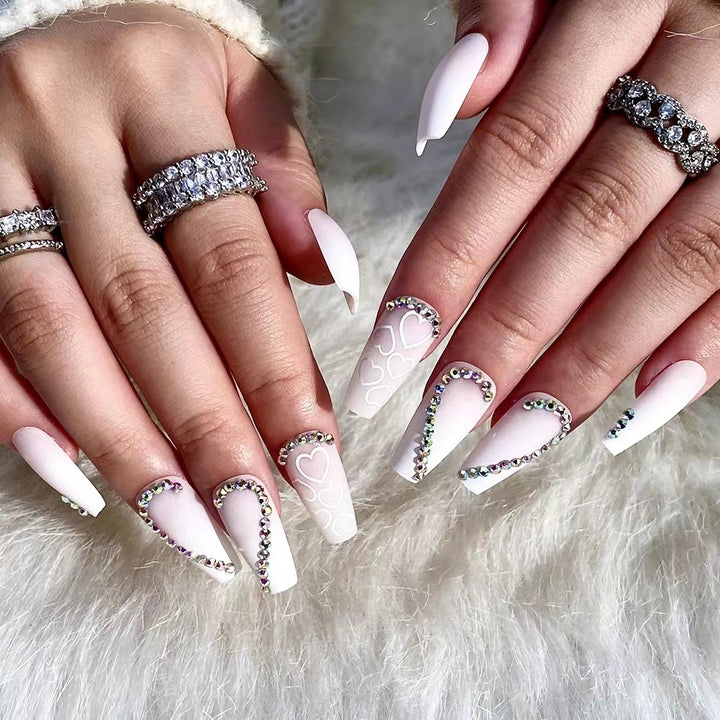 Artful Nail Extensions with Heart Design and Glitter Accents Stornfield