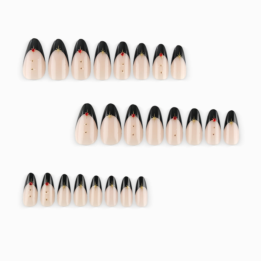 Glamorous artificial nails in stylish stiletto design with golden accents Stornfield