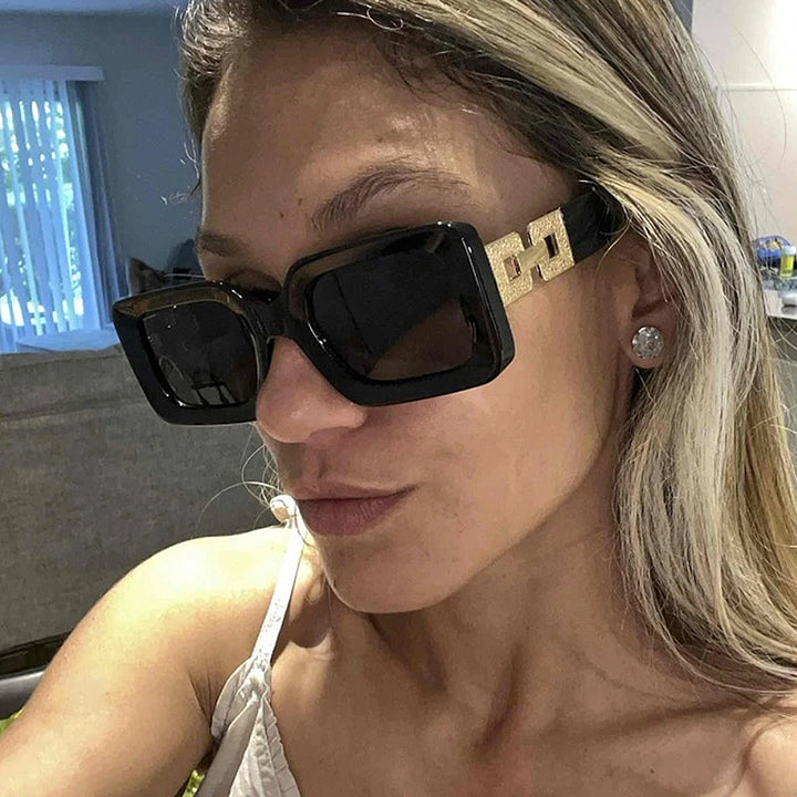 Women’s fashionable sunglasses in elegant square design with luxurious golden accents Stornfield