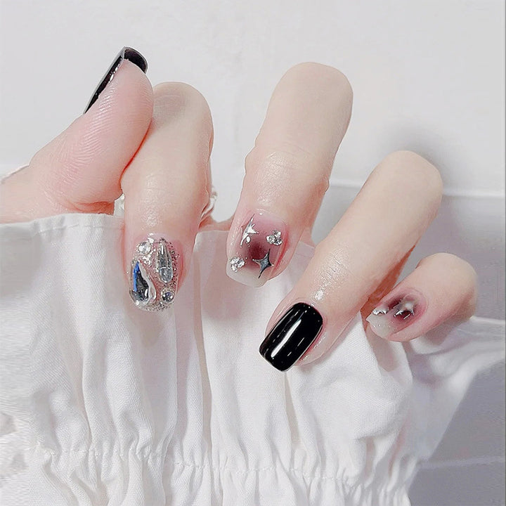 Artificial nail set with glamorous glitter and crystal decorations Stornfield