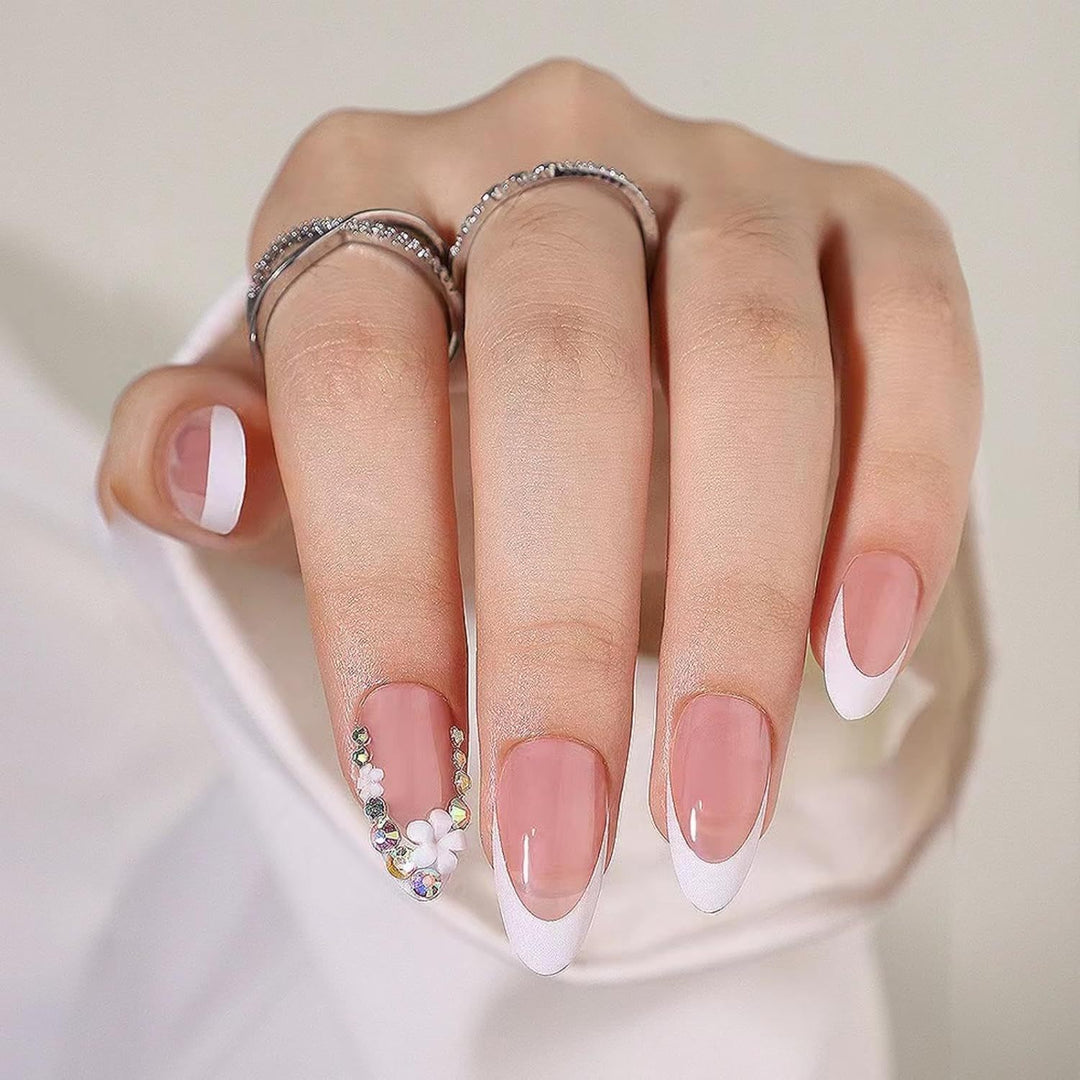 Artificial nails with elegant French tips and rhinestone details Stornfield