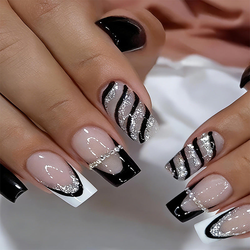 Artificial nail set with glamorous glitter and stripe designs Stornfield