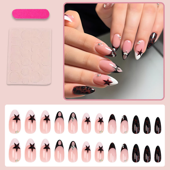 Acrylic nail set with creative star patterns and glitter accents Stornfield