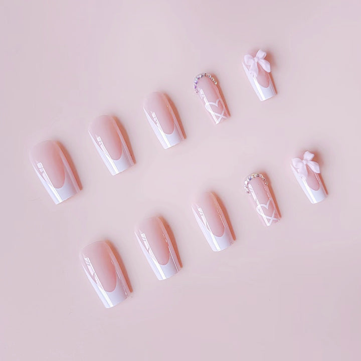 Nail art set with elegant 3D bows and rhinestone embellishments Stornfield