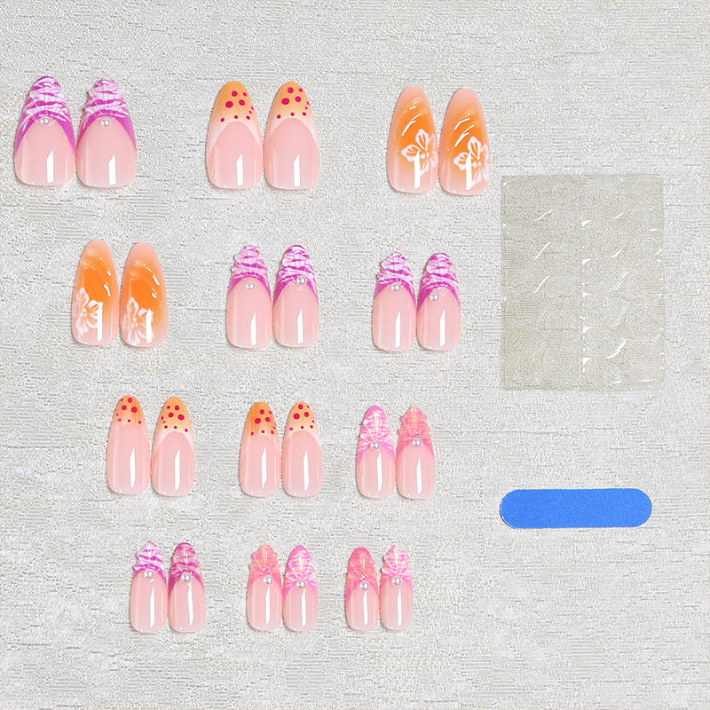 Acrylic nail set with exotic flower patterns and glitter accents Stornfield