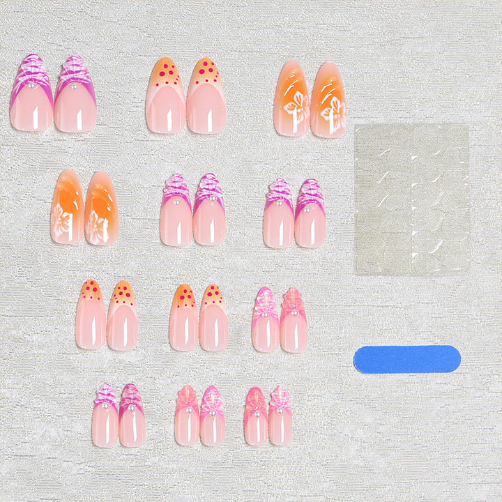 Acrylic nail set with exotic flower patterns and glitter accents Stornfield