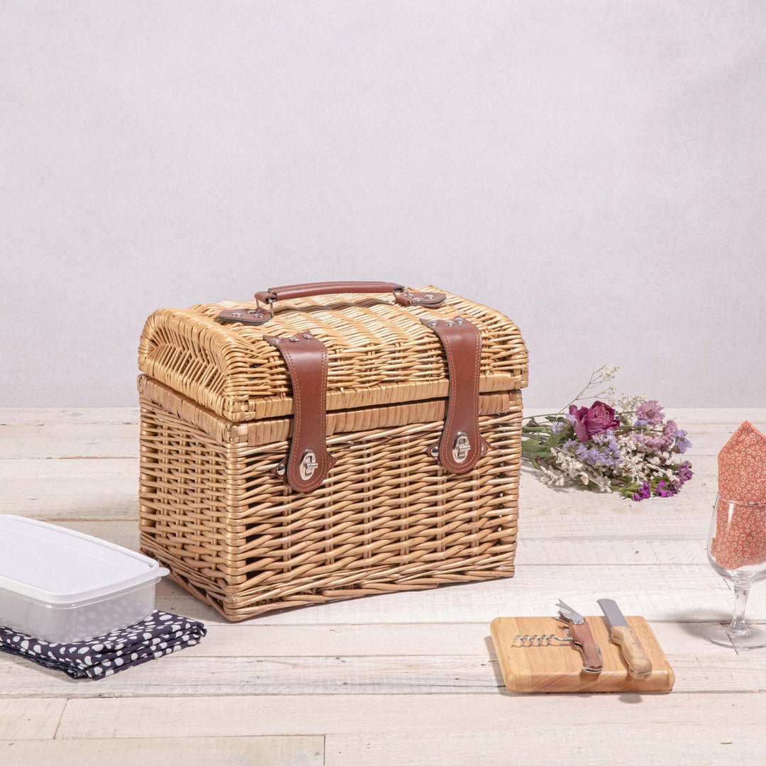 Ladies picnic basket with stylish glasses and wooden boards Stornfield