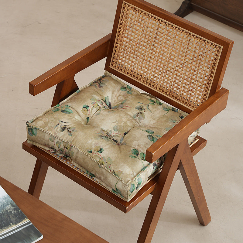 Padded seat cushion with tufting and bamboo motif