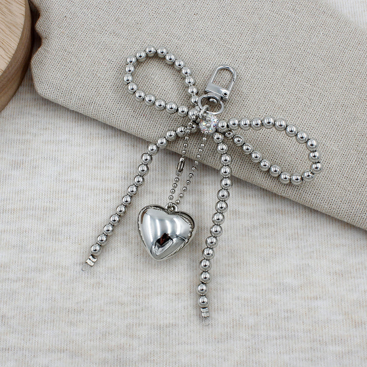 Elegant Beaded Bow Brooch Stornfield