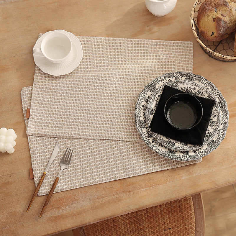 Rectangular table set made of woven herringbone cotton blend with anti-slip coating Stornfield