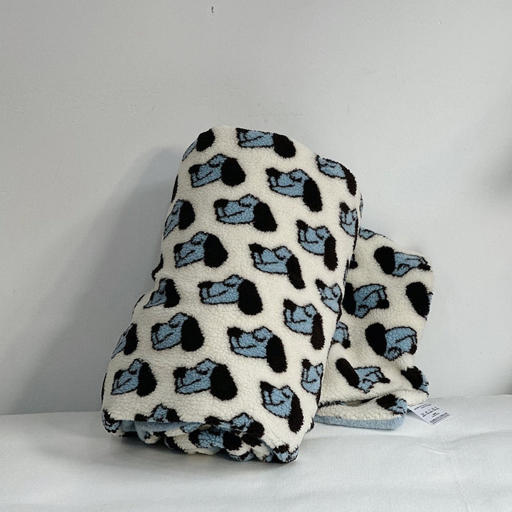 Plush Sherpa throw blanket with abstract pattern and extra-soft teddy fleece