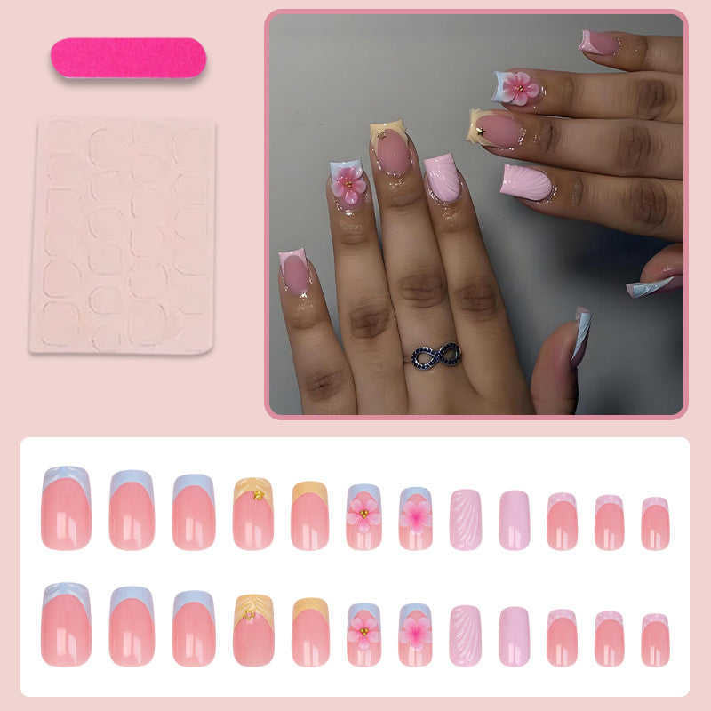 Acrylic nail set with elegant flower motifs and colorful designs Stornfield
