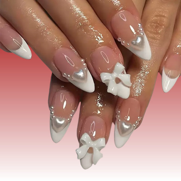 Elegant artificial nails with curved tips and decorative bows Stornfield